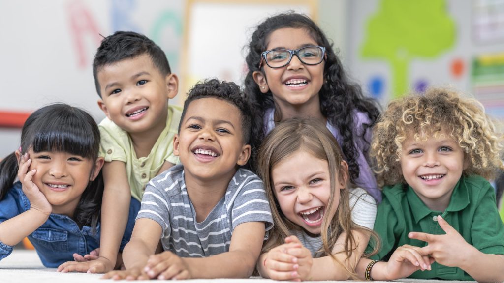 Group of kids smiling at Grandville pediatric dental office