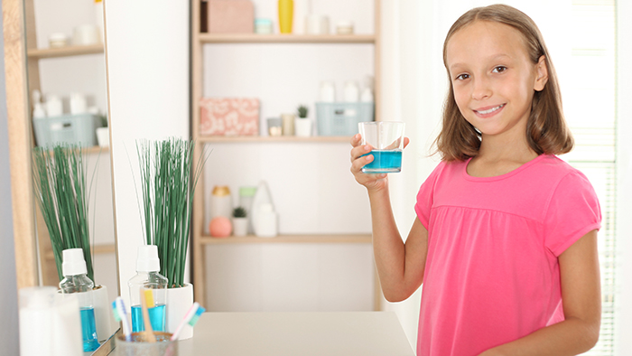 Kid Using Mouthwash Grandville MI Pediatric Dentists